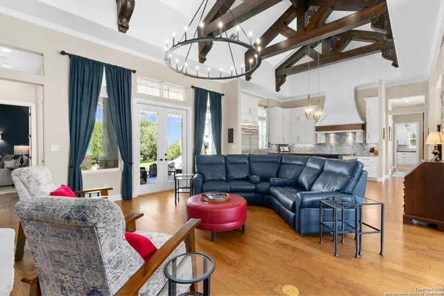 a kitchen with kitchen island granite countertop a sink a counter space appliances and cabinets