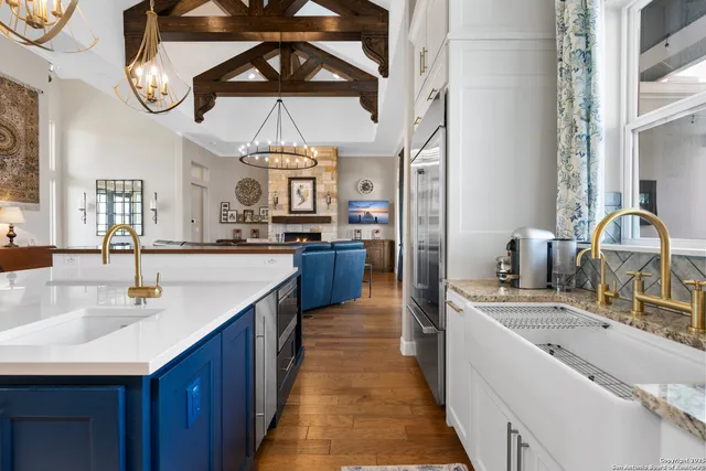 a spacious bathroom with a tub sink and mirror