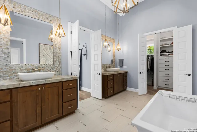 a bedroom with a large bed and a large window