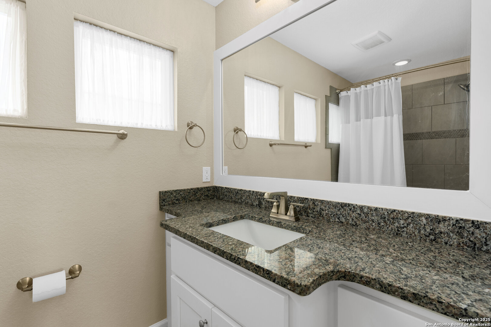 30 VERDE Point Boerne, TX 78006 - Photo 45 of 62 a bathroom with a granite countertop sink and a mirror