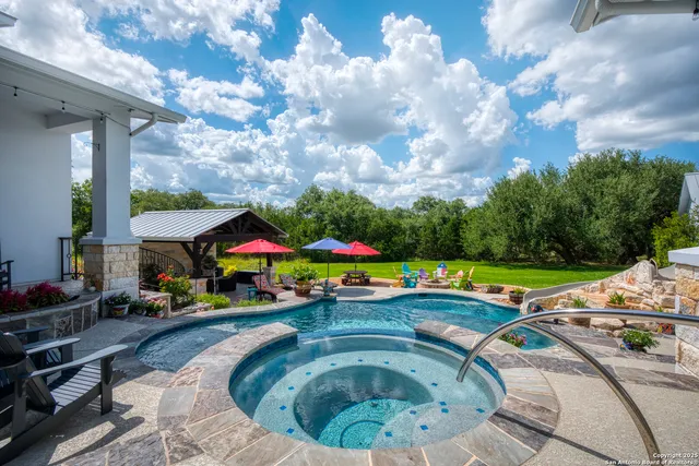 a bathroom with a granite countertop sink a toilet and a mirror