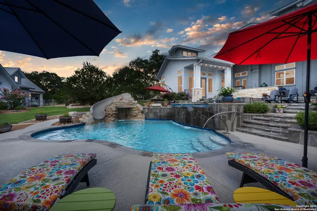 a view of a chairs and table in the patio