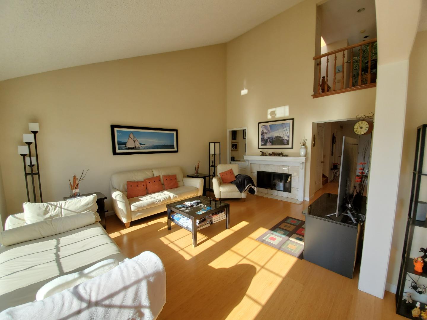 13 Merion Road Half Moon Bay, CA 94019 - Photo 3 of 14 a living room with furniture fireplace and a flat screen tv