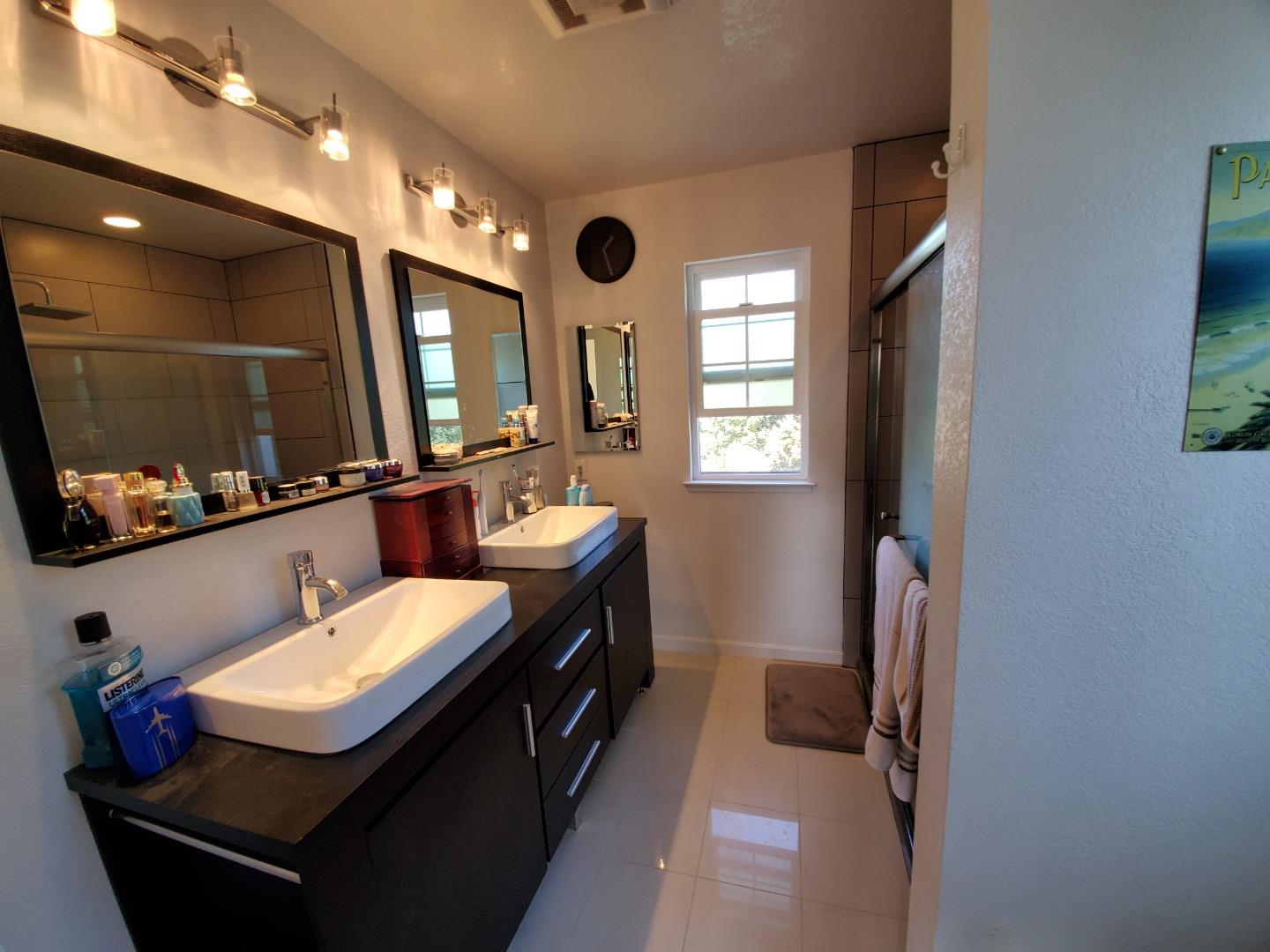 13 Merion Road Half Moon Bay, CA 94019 - Photo 8 of 14 a bathroom with a sink double vanity and a mirror