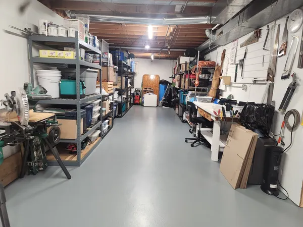 a room with lots of wooden furniture and a view of living room