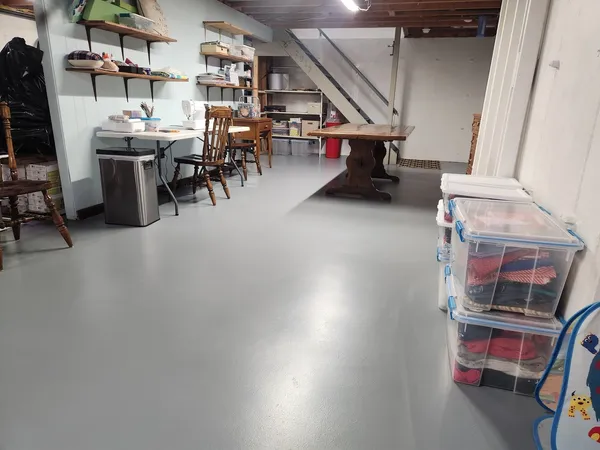 a living room with lots of furniture and a chandelier