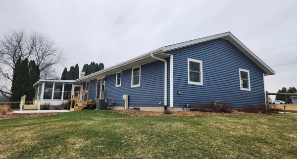 a view of a lake with houses in the back