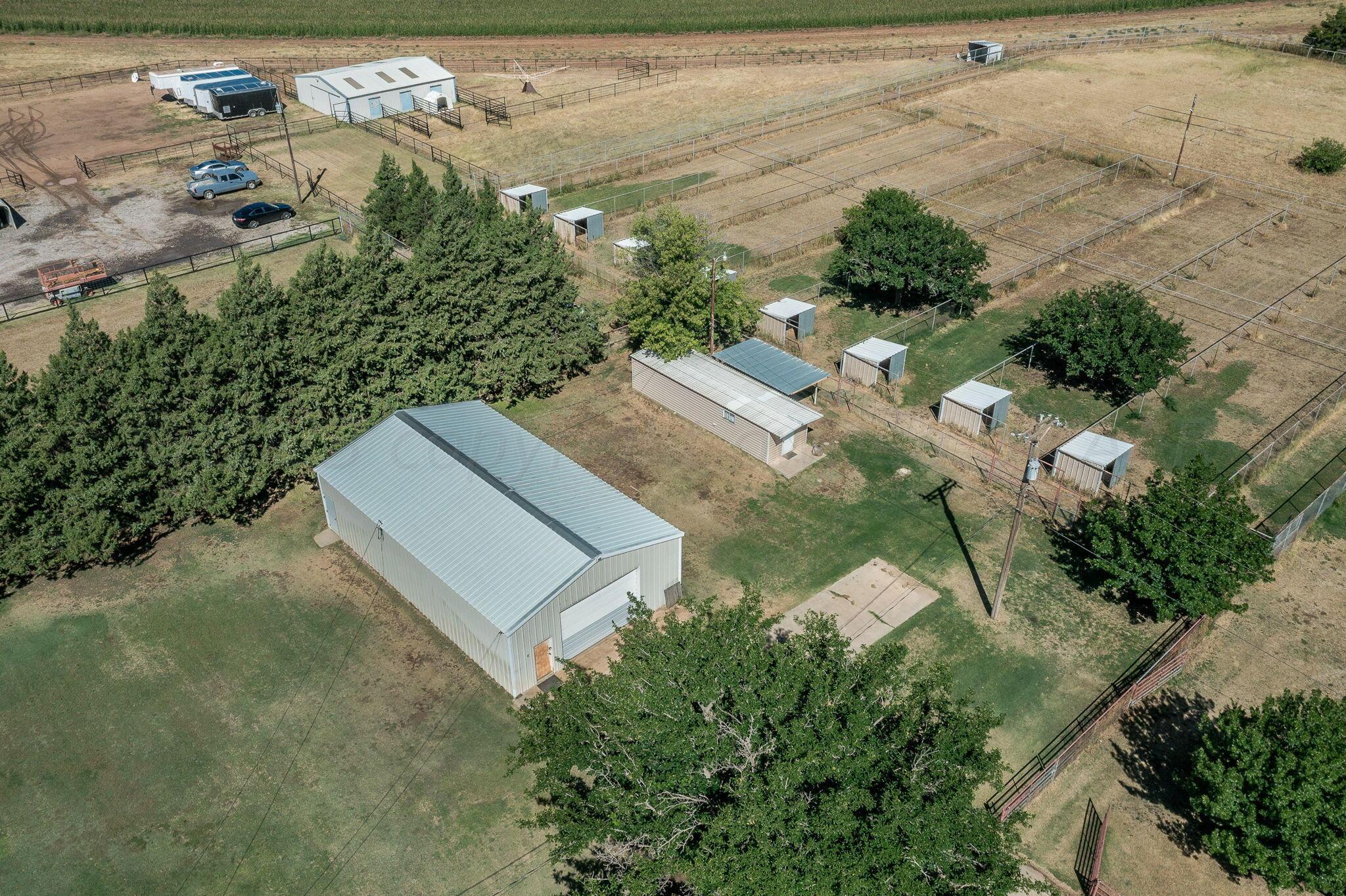 7424 Olton Road Plainview, TX 79072 - Photo 54 of 55 an aerial view of a house with a yard