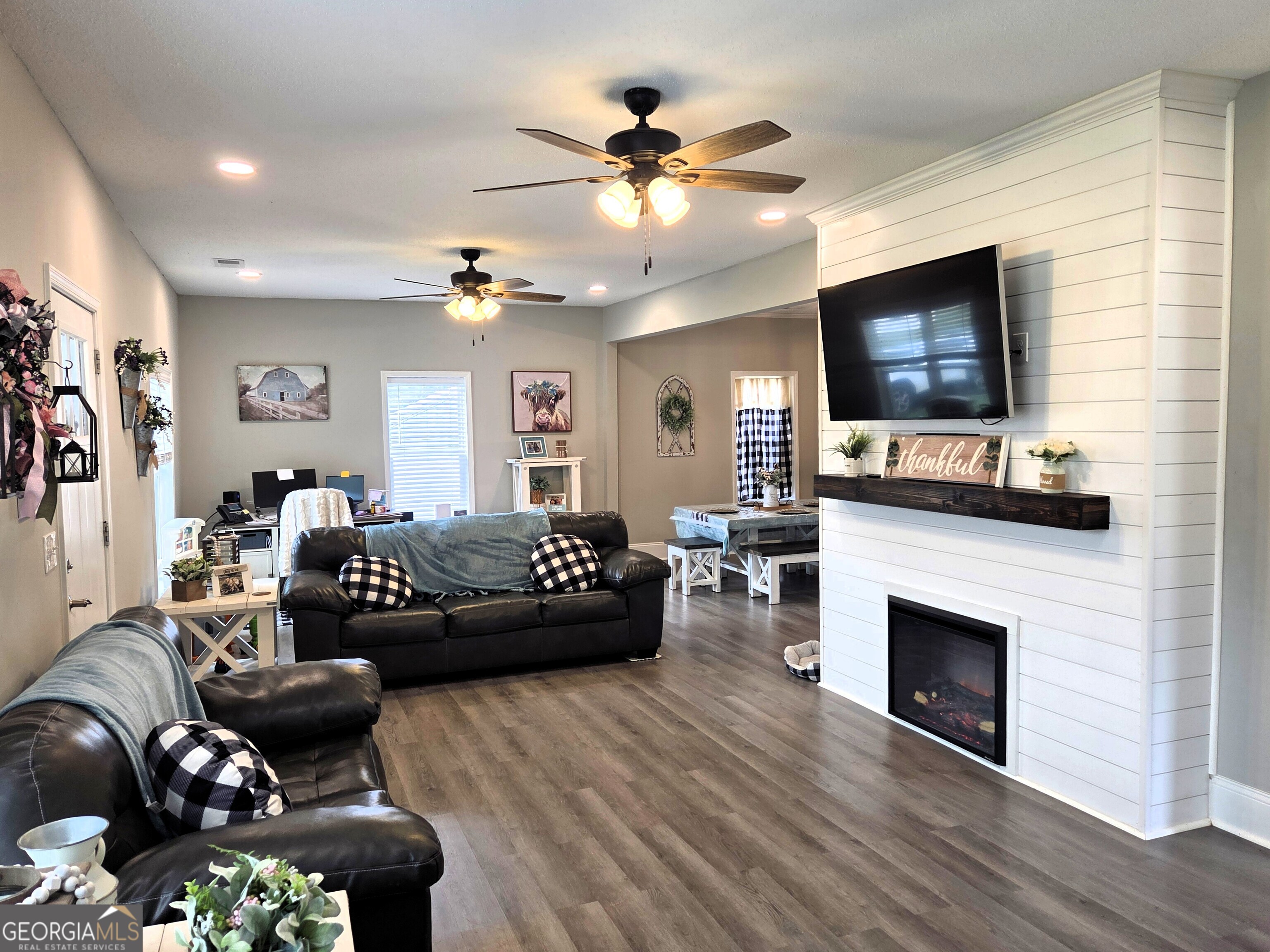 464 Hair Lake Road Summerville, GA 30747 - Photo 3 of 37 a living room with furniture a flat screen tv and a fireplace