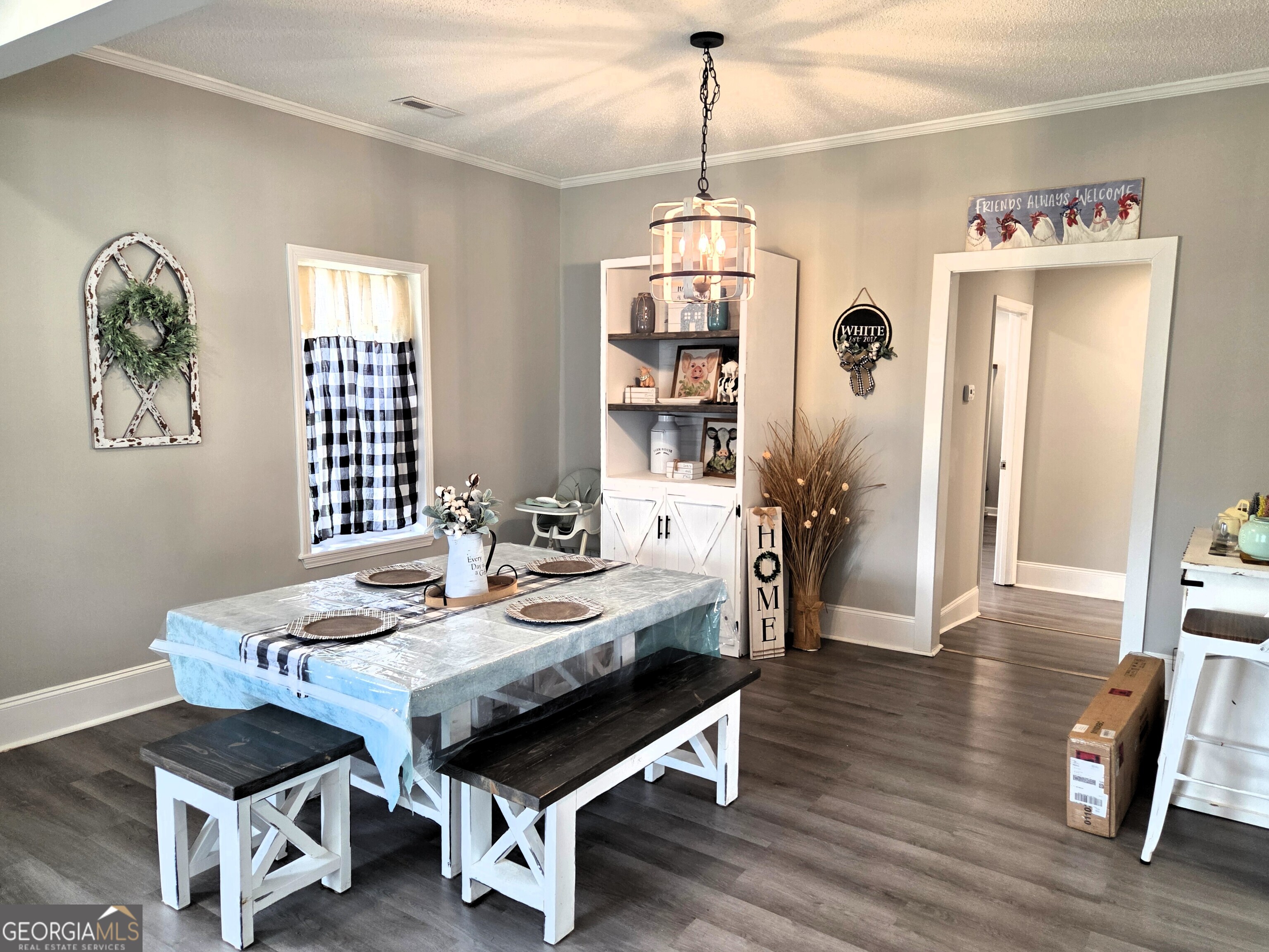 464 Hair Lake Road Summerville, GA 30747 - Photo 5 of 37 a view of a dining room and livingroom with furniture wooden floor a chandelier