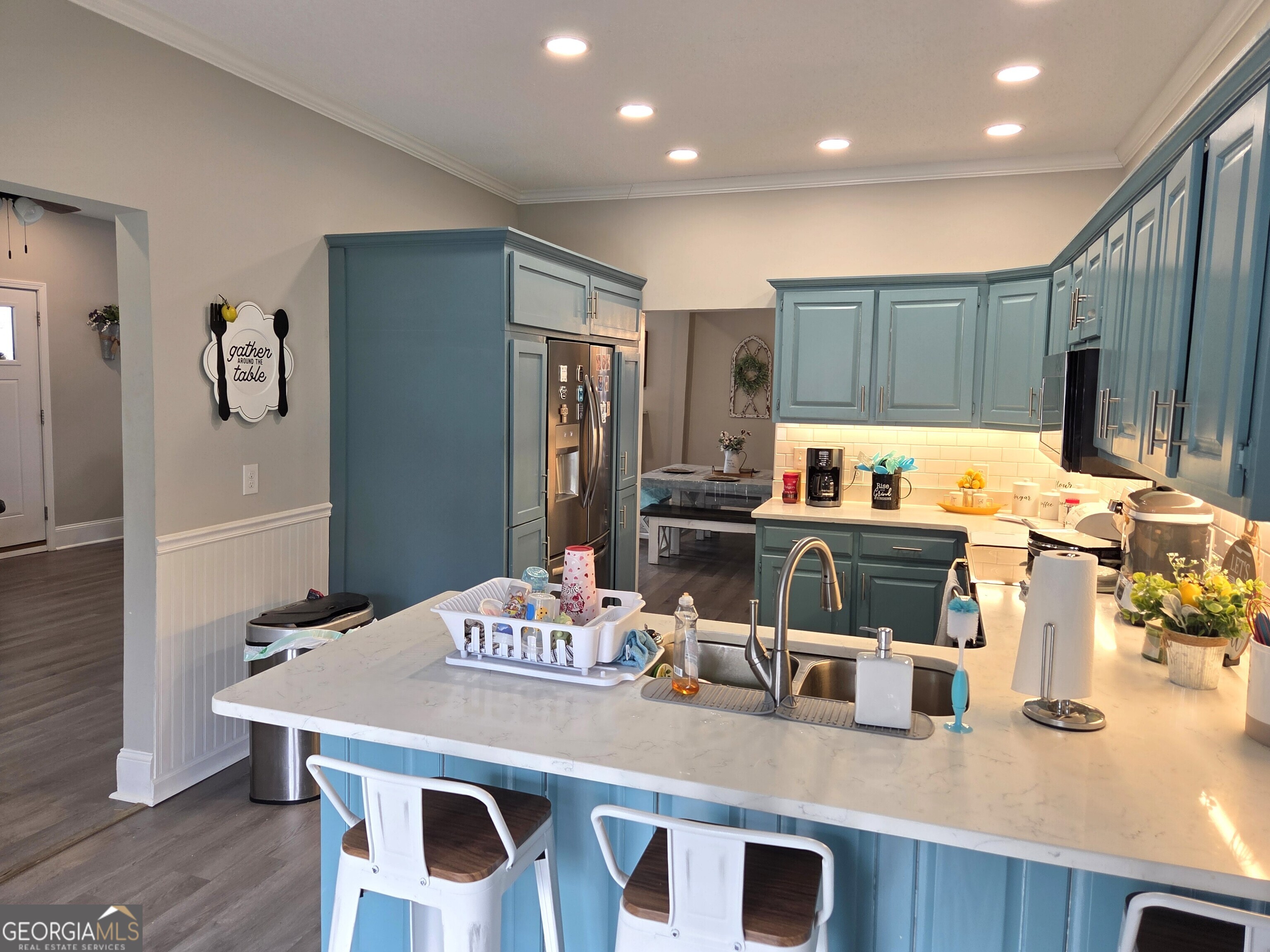 464 Hair Lake Road Summerville, GA 30747 - Photo 8 of 37 a kitchen with stainless steel appliances granite countertop a kitchen island a stove a sink a dining table and chairs