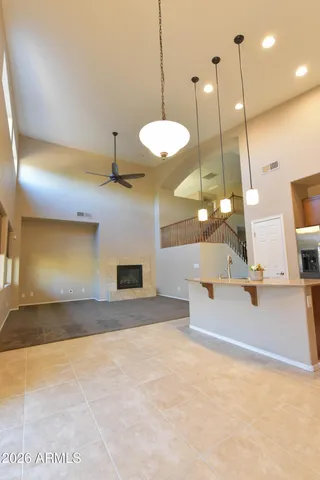 a view of a room with a table and chairs