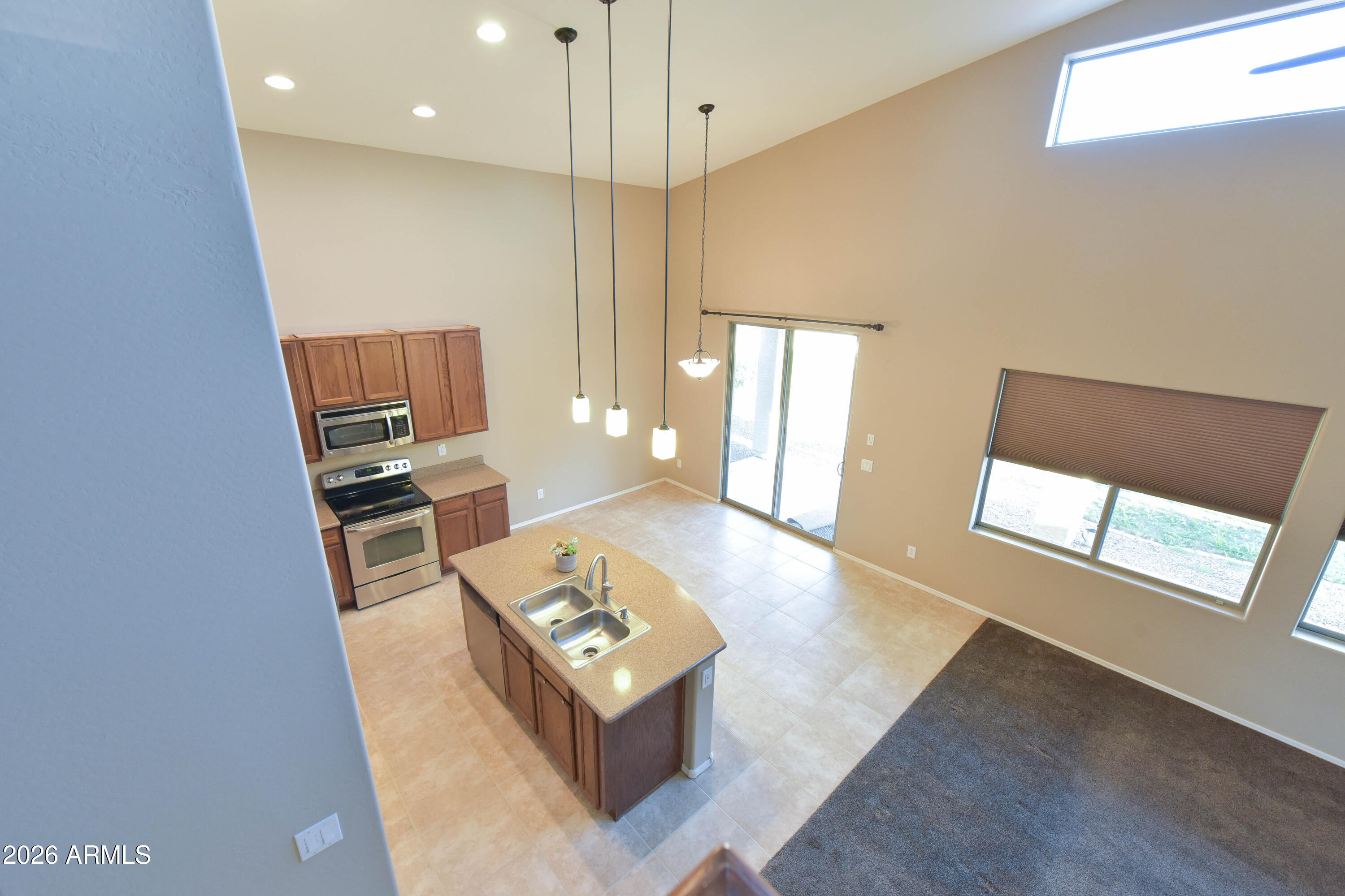 2546 East San Rafael Trail Casa Grande, AZ 85194 - Photo 15 of 41 a living room with furniture and a table