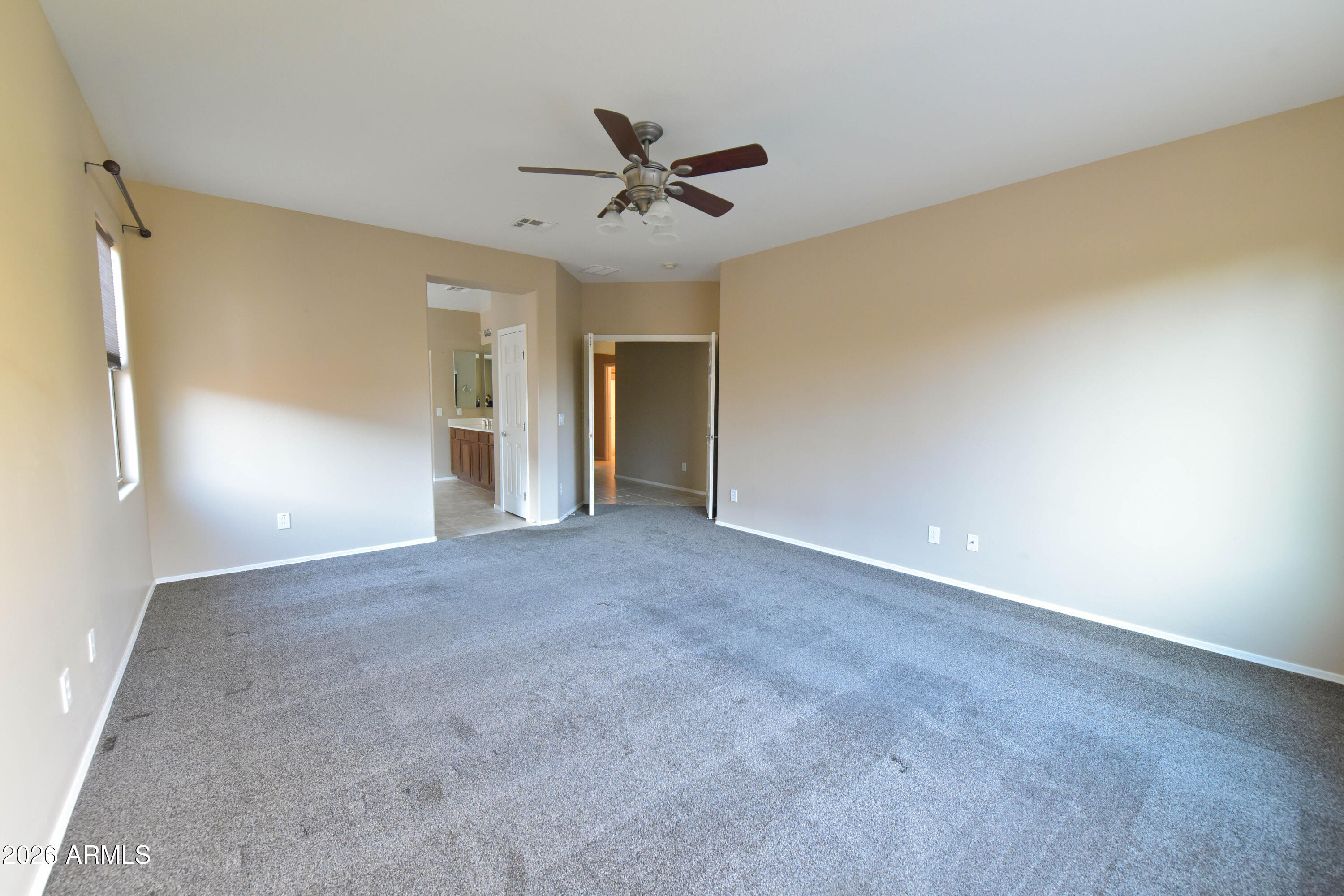 2546 East San Rafael Trail Casa Grande, AZ 85194 - Photo 17 of 41 a view of a livingroom with a ceiling fan and window