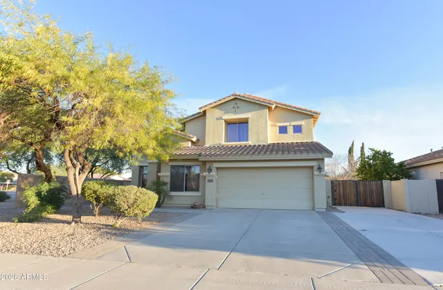 a front view of a house with a garage