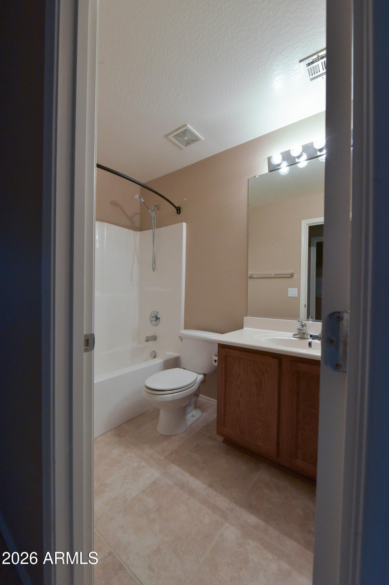 2546 East San Rafael Trail Casa Grande, AZ 85194 - Photo 24 of 41 a bathroom with a bathtub a toilet a sink and mirror