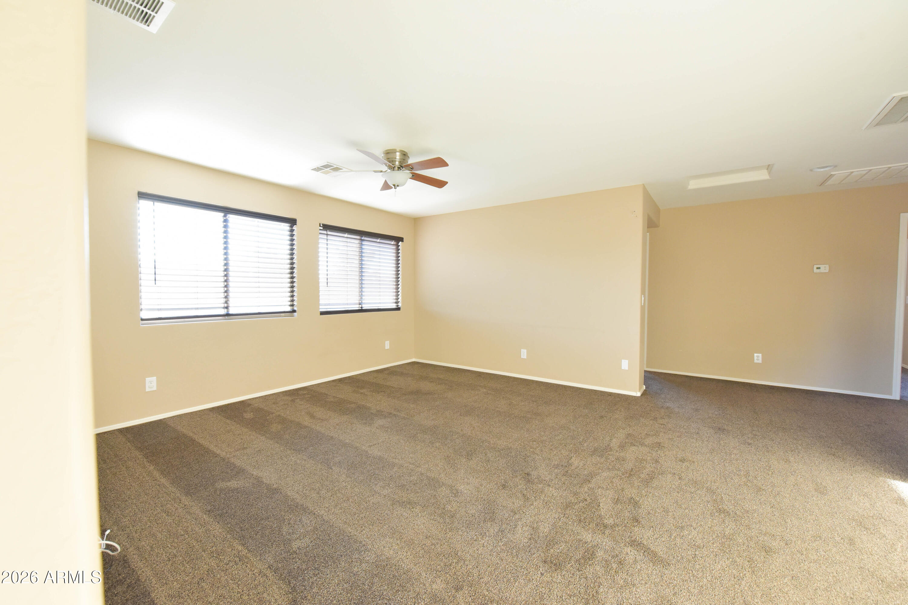2546 East San Rafael Trail Casa Grande, AZ 85194 - Photo 27 of 41 a view of an empty room with a window