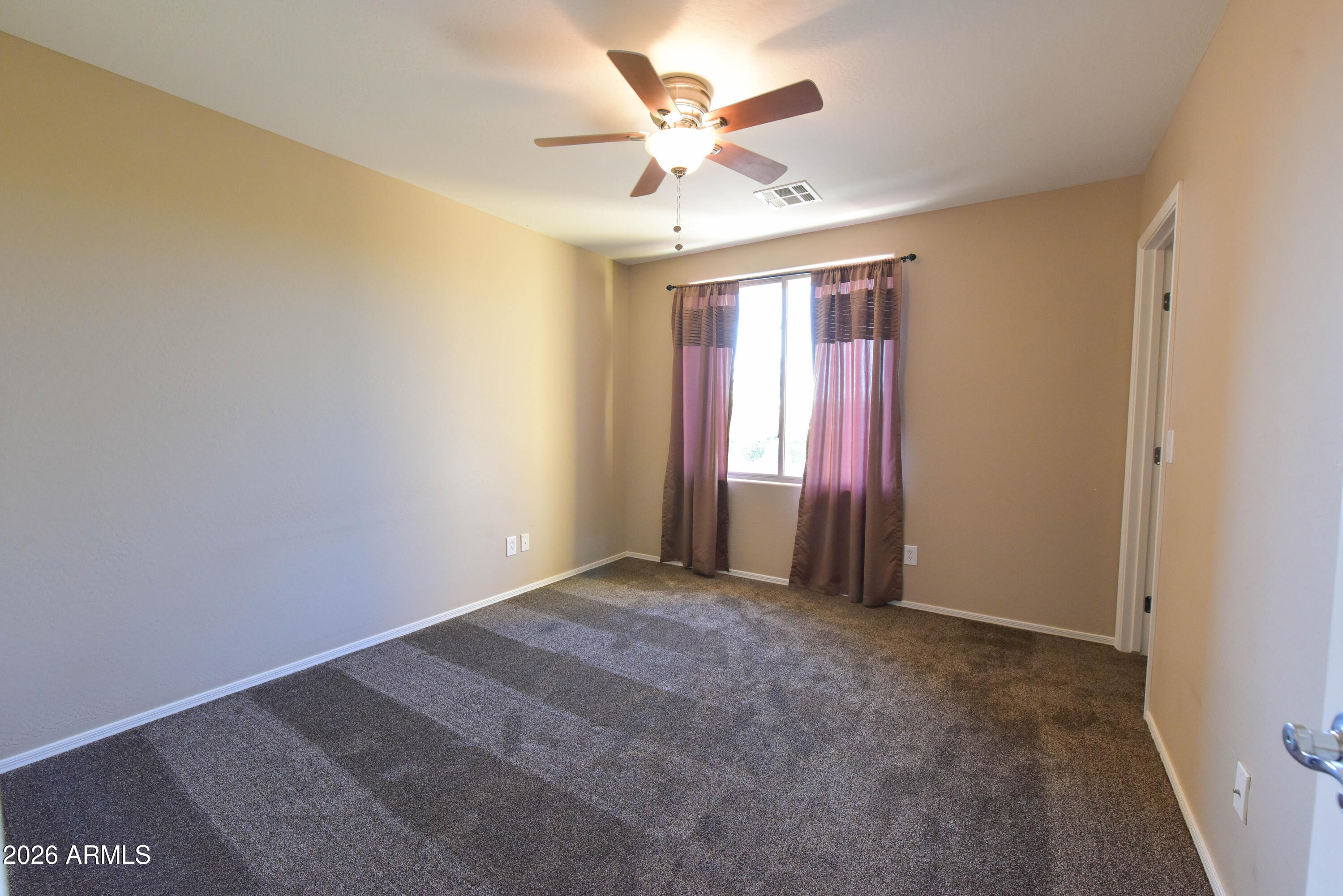 2546 East San Rafael Trail Casa Grande, AZ 85194 - Photo 33 of 41 a view of an empty room with a window