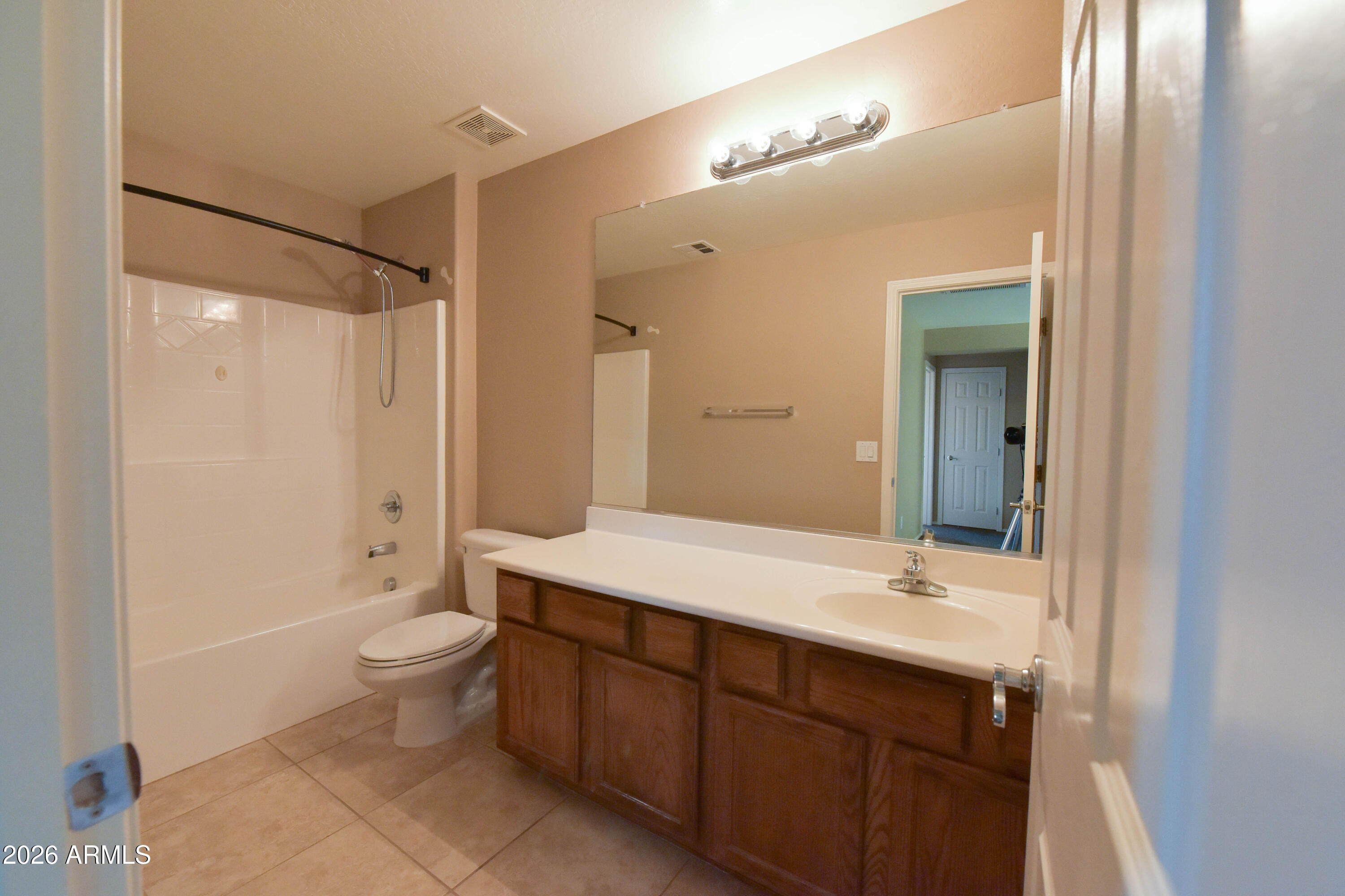 2546 East San Rafael Trail Casa Grande, AZ 85194 - Photo 35 of 41 a bathroom with a double vanity sink toilet mirror and bathtub