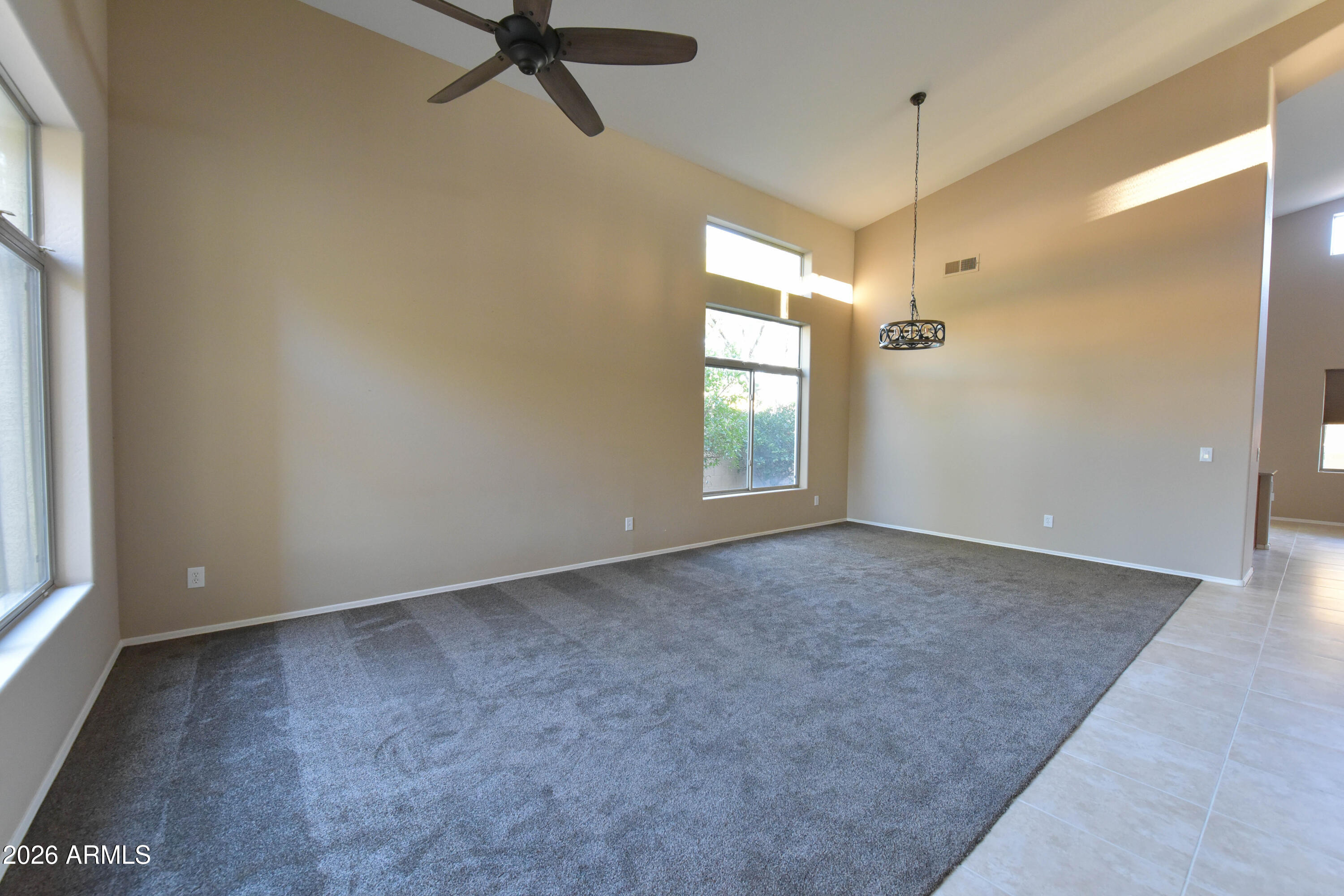 2546 East San Rafael Trail Casa Grande, AZ 85194 - Photo 6 of 41 wooden floor and window in an empty room