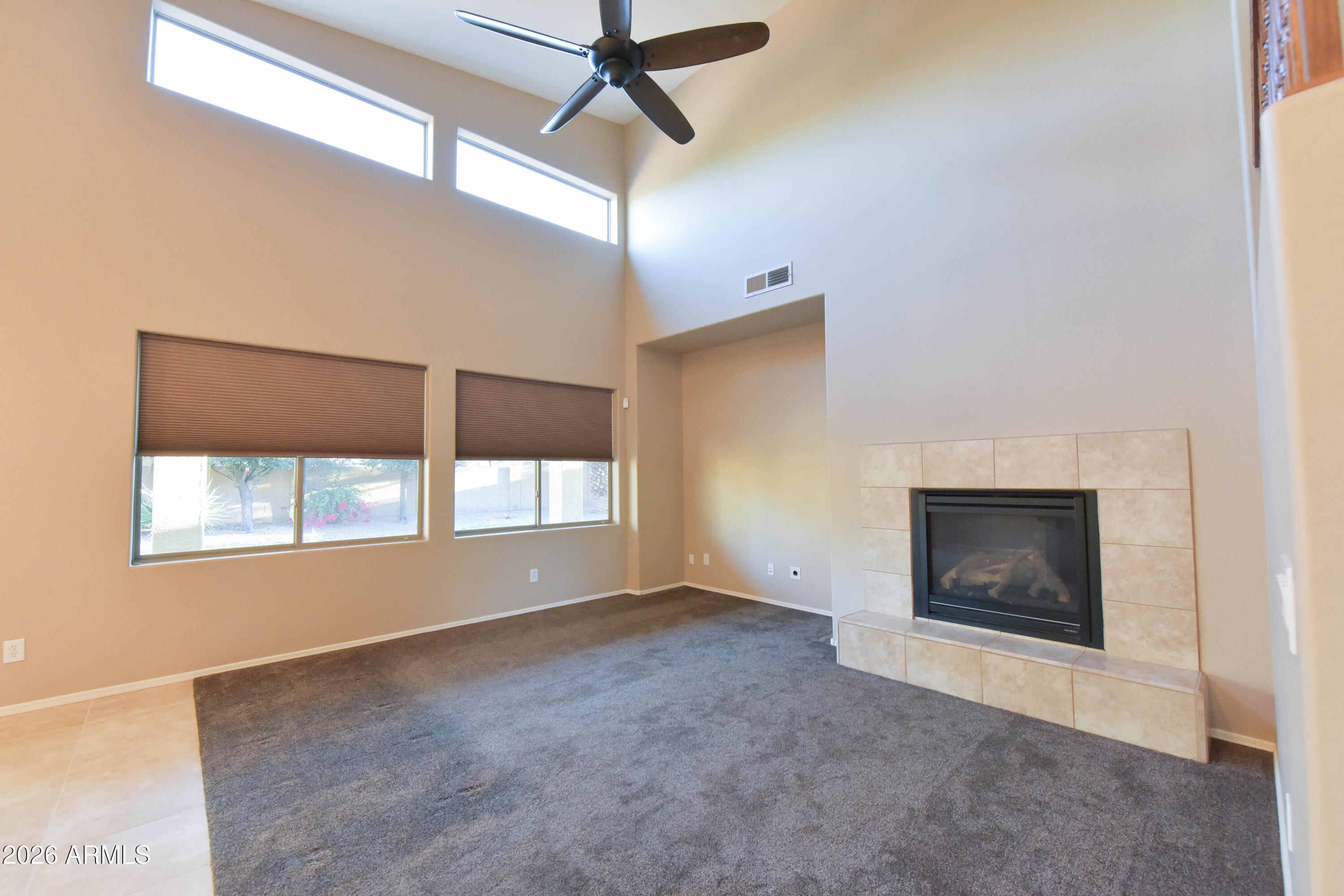 2546 East San Rafael Trail Casa Grande, AZ 85194 - Photo 10 of 41 a view of an empty room with a window and fireplace