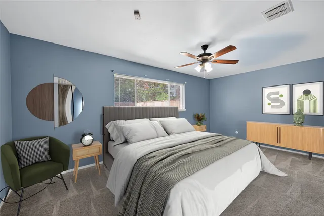 a bedroom with a bed and window