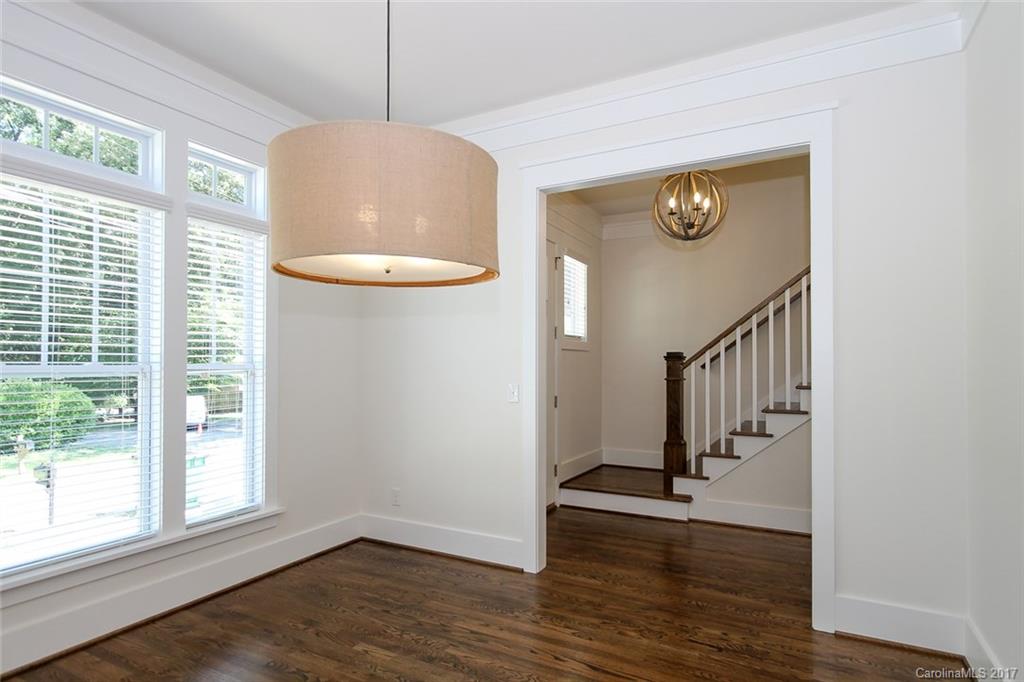908 Millbrook Road, Unit B Charlotte, NC 28211 - Photo 11 of 23 a view of a hallway with wooden floor and staircase