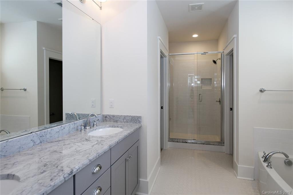 908 Millbrook Road, Unit B Charlotte, NC 28211 - Photo 14 of 23 a bathroom with a granite countertop sink mirror and double