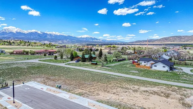 a view of a golf course with a table and chairs