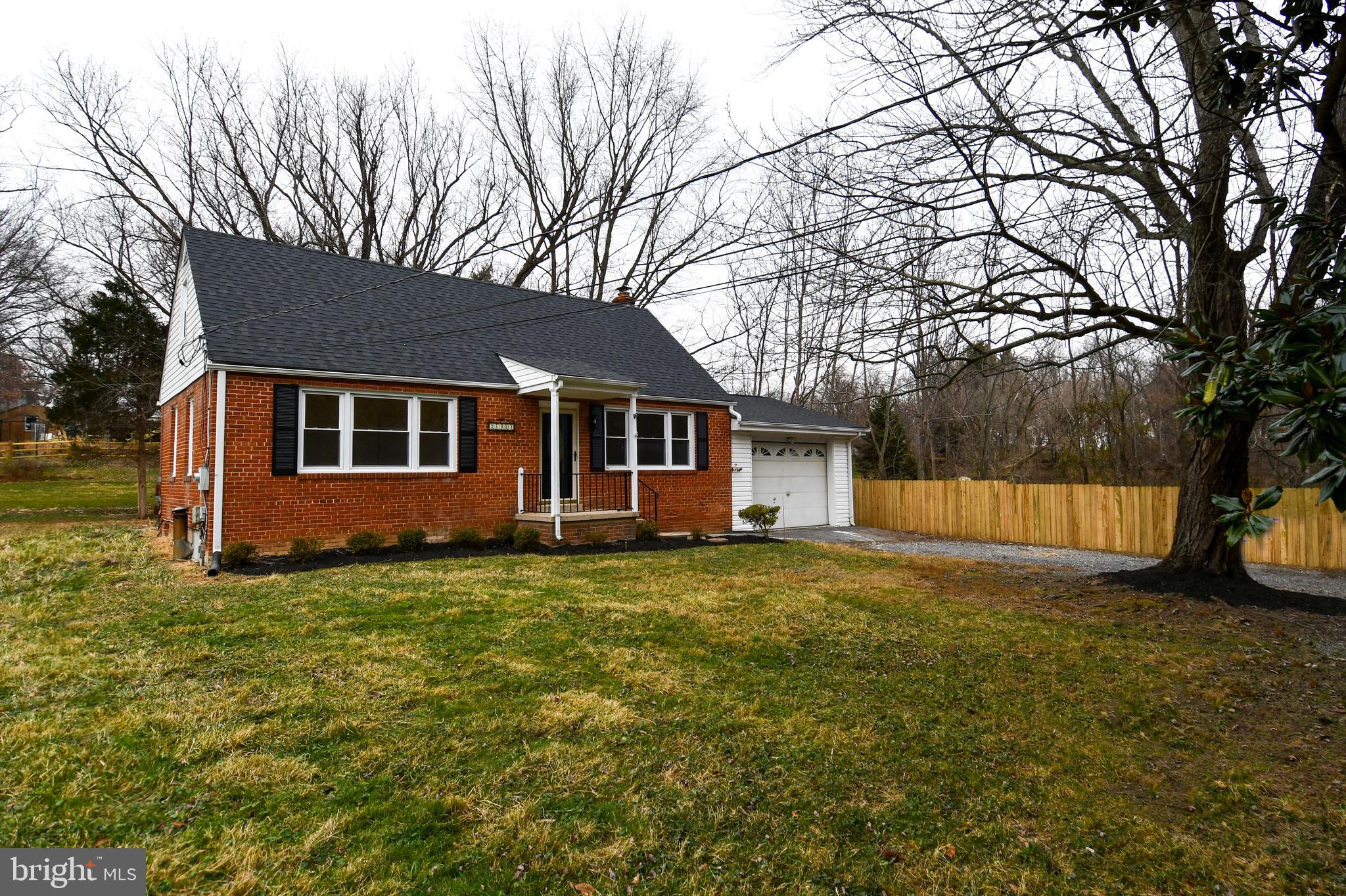 26904 Overlook Street Damascus, MD 20872 - Photo 2 of 54 a view of a house with a yard