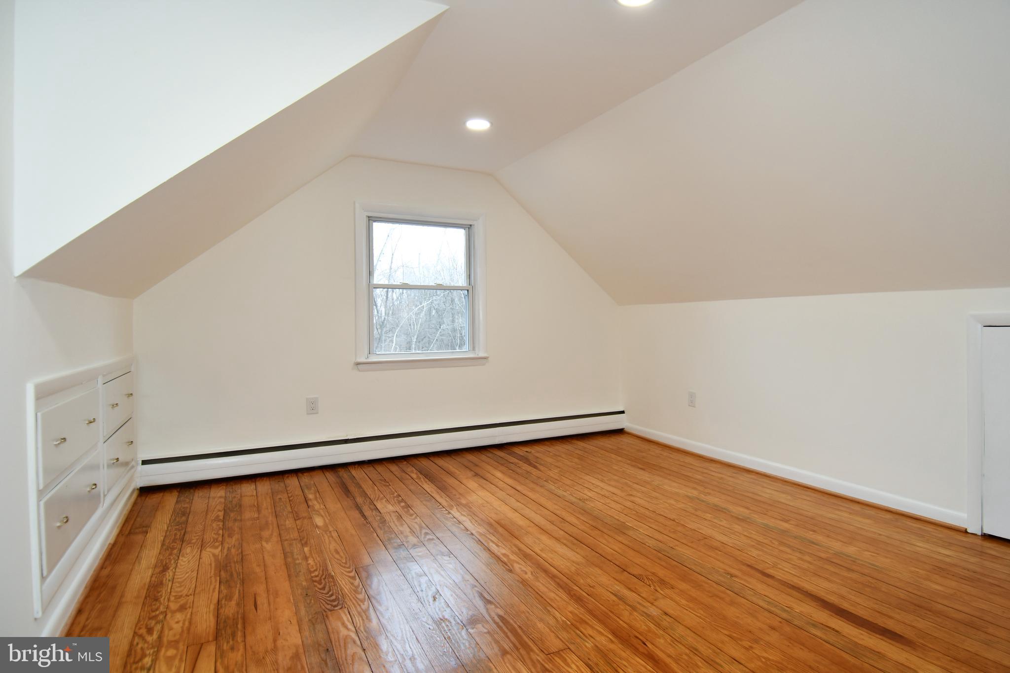 26904 Overlook Street Damascus, MD 20872 - Photo 25 of 54 an empty room with wooden floor and windows