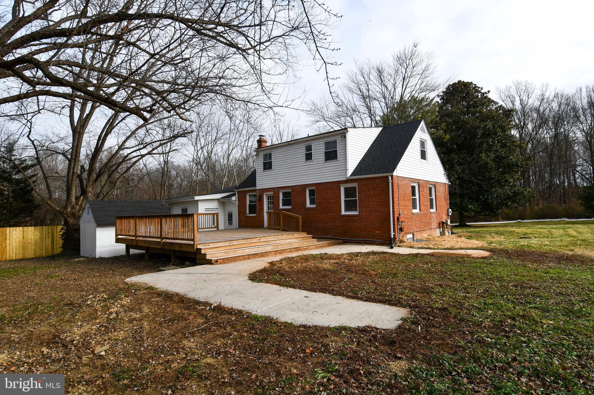 26904 Overlook Street Damascus, MD 20872 - Photo 4 of 54 a view of a yard in front of a house