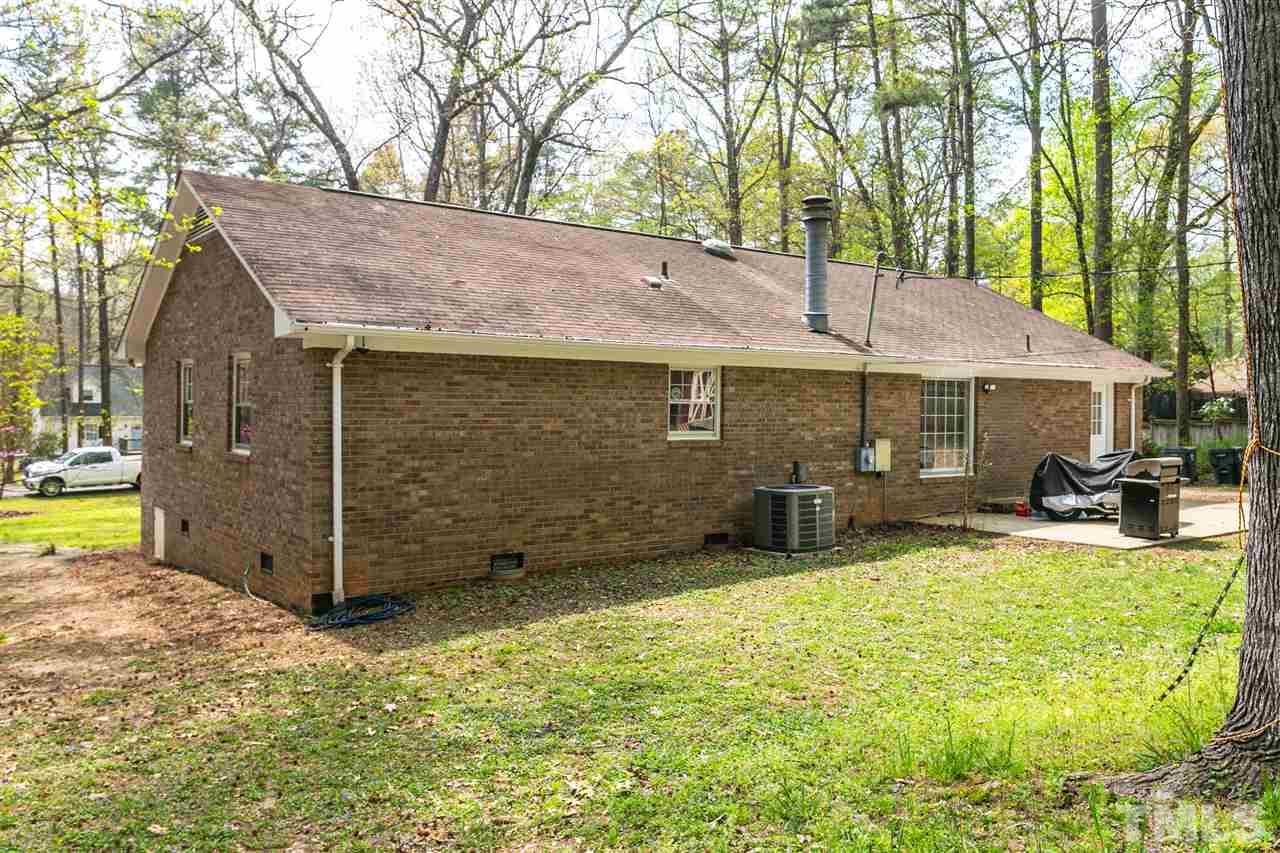 910 Prologue Road Durham, NC 27712 - Photo 22 of 26 a view of a house with backyard porch and sitting area