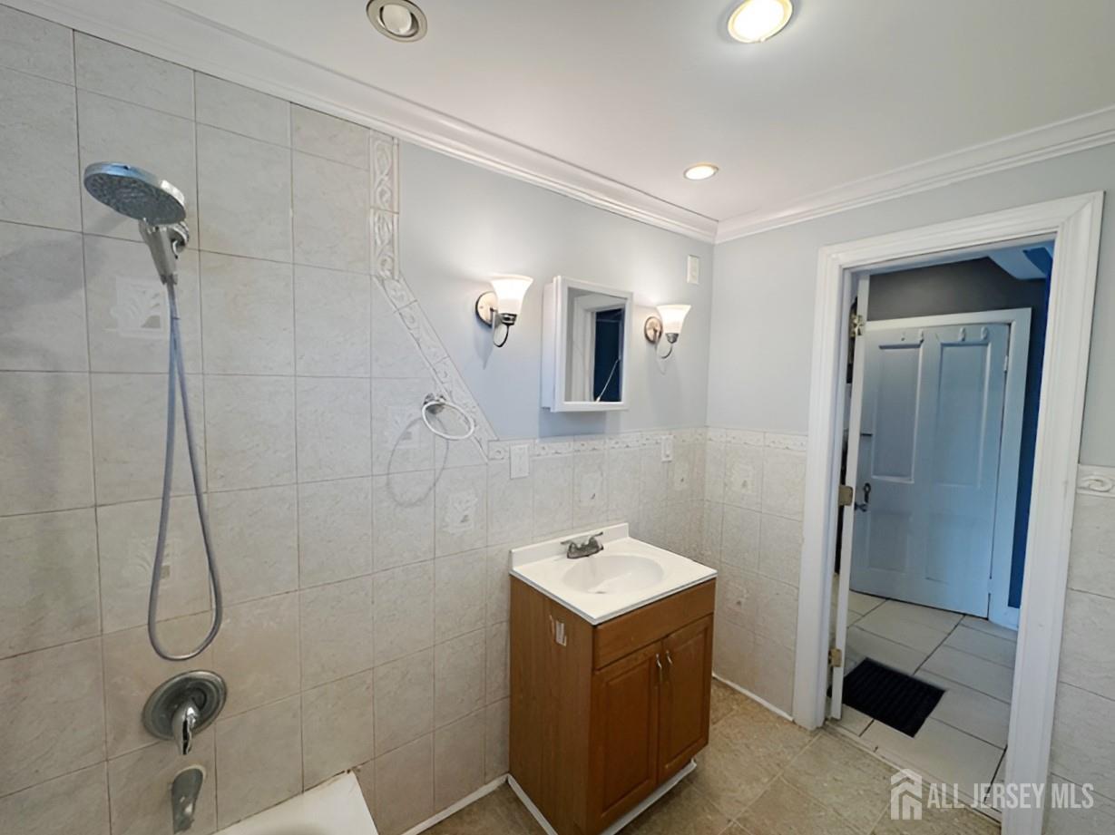 20 Mabel Street Ewing, NJ 08638 - Photo 17 of 31 a bathroom with a sink mirror and shower