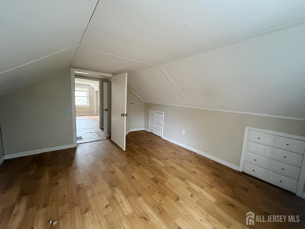 20 Mabel Street Ewing, NJ 08638 - Photo 23 of 31 a view of an empty room and wooden floor