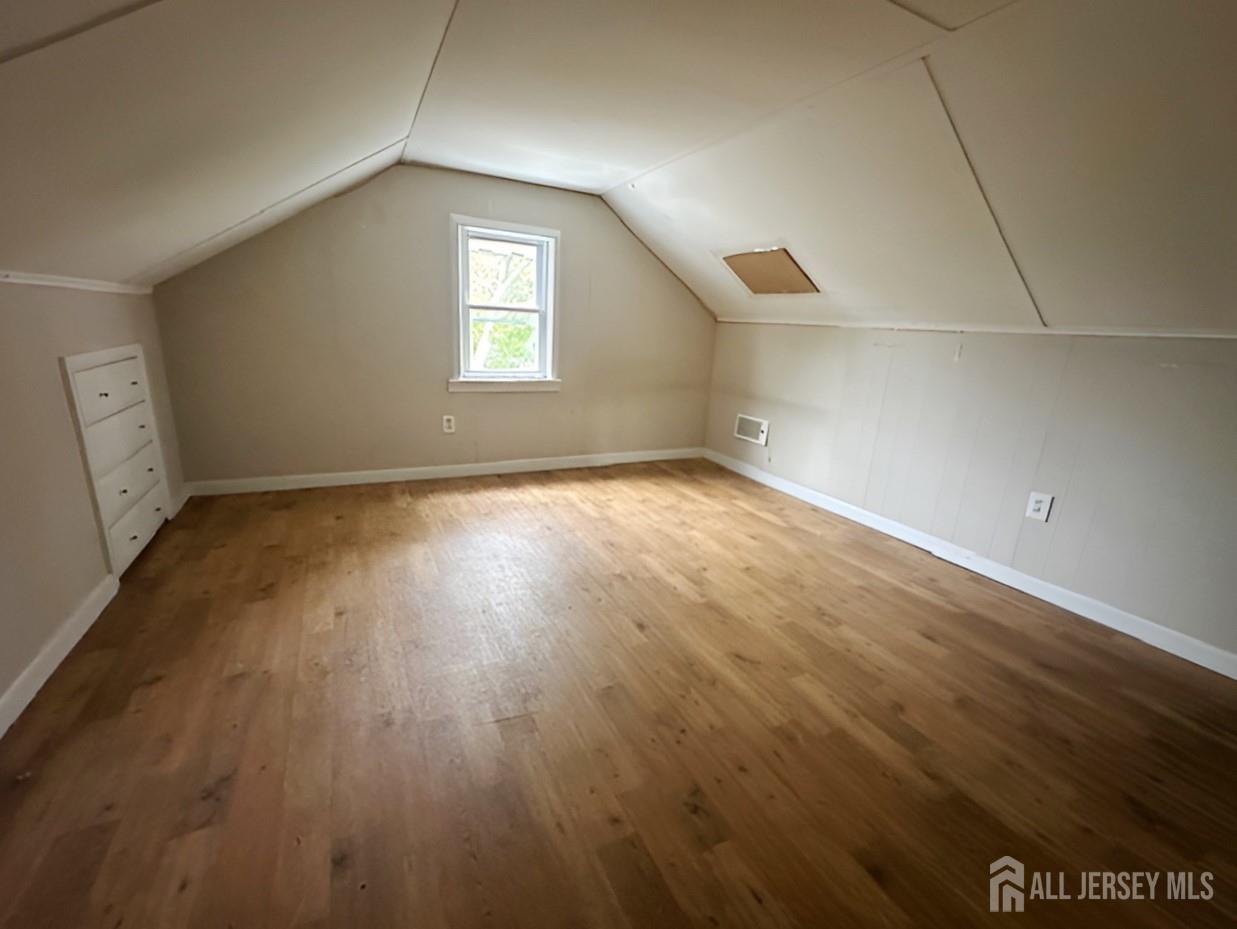 20 Mabel Street Ewing, NJ 08638 - Photo 24 of 31 an empty room with wooden floor and windows