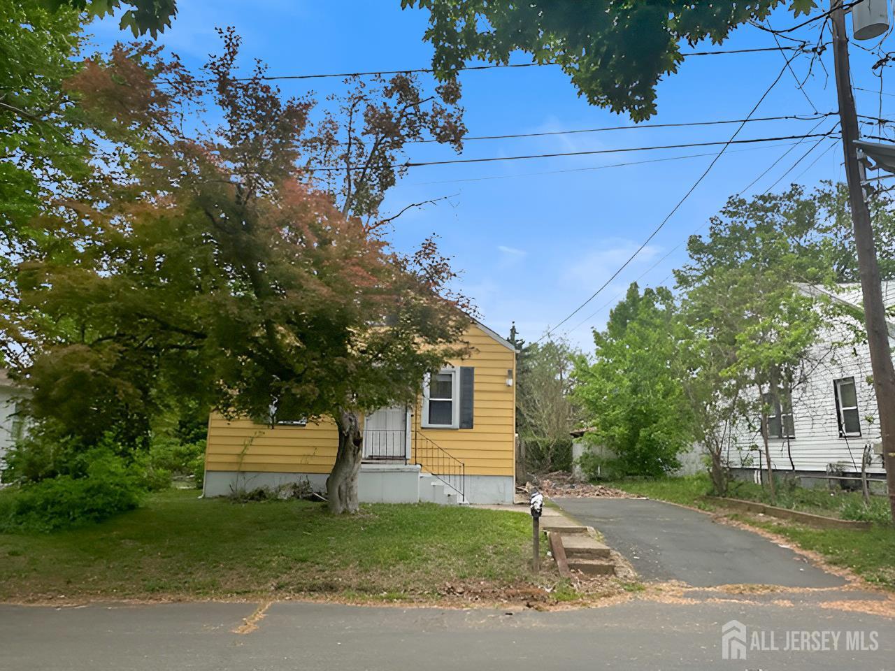 20 Mabel Street Ewing, NJ 08638 - Photo 30 of 31 a front view of a house with a garden