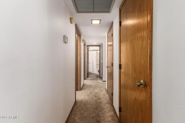 a view of a livingroom with a fireplace furniture and a ceiling fan
