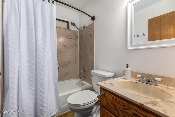 a bedroom with a bed and a television