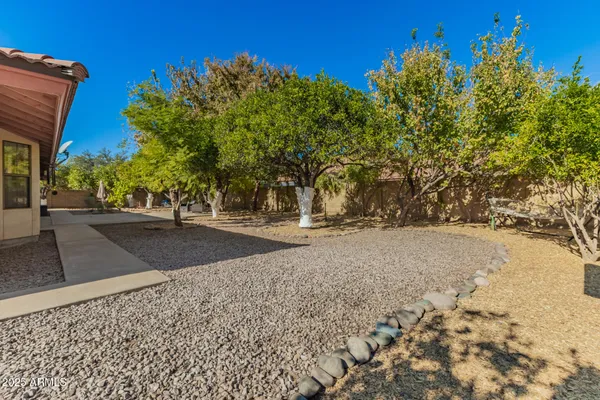 a backyard of a house with lots of green space