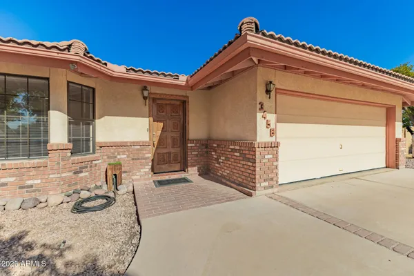 front view of a house with a yard