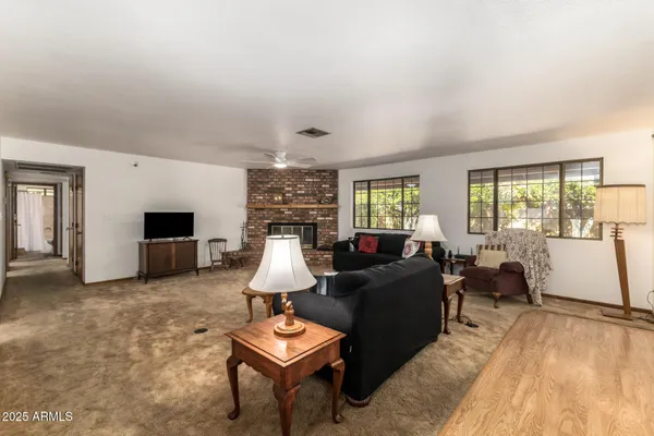 a living room with furniture and a fireplace