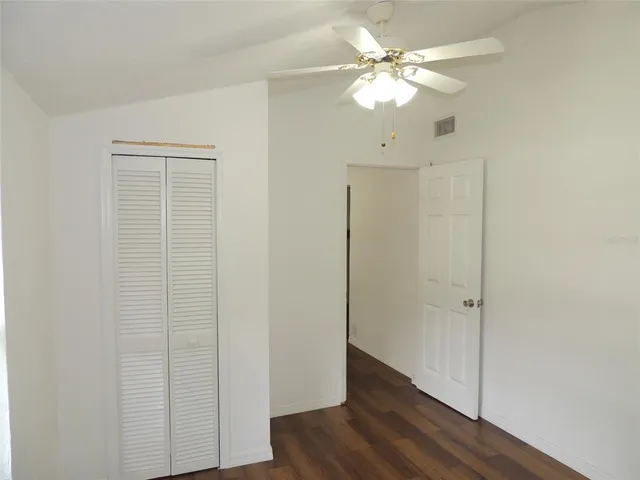 wooden floor in a hall with a window