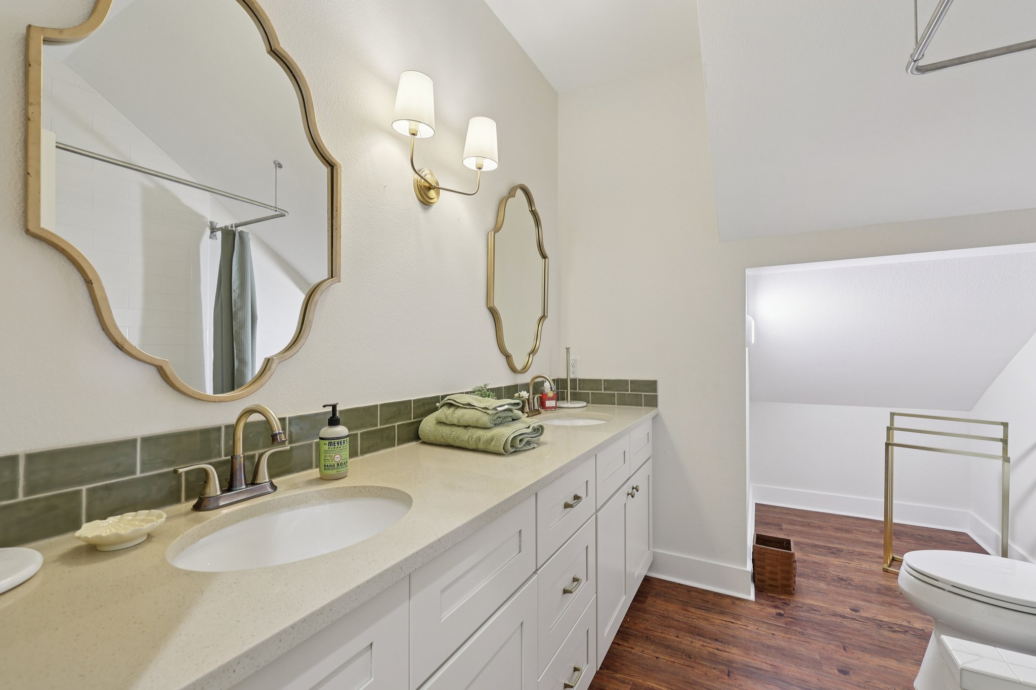 546 McAllister Road Bastrop, TX 78602 - Photo 35 of 40 Full bathroom with double vanity, dark wood-style floors, and a shower with curtain
