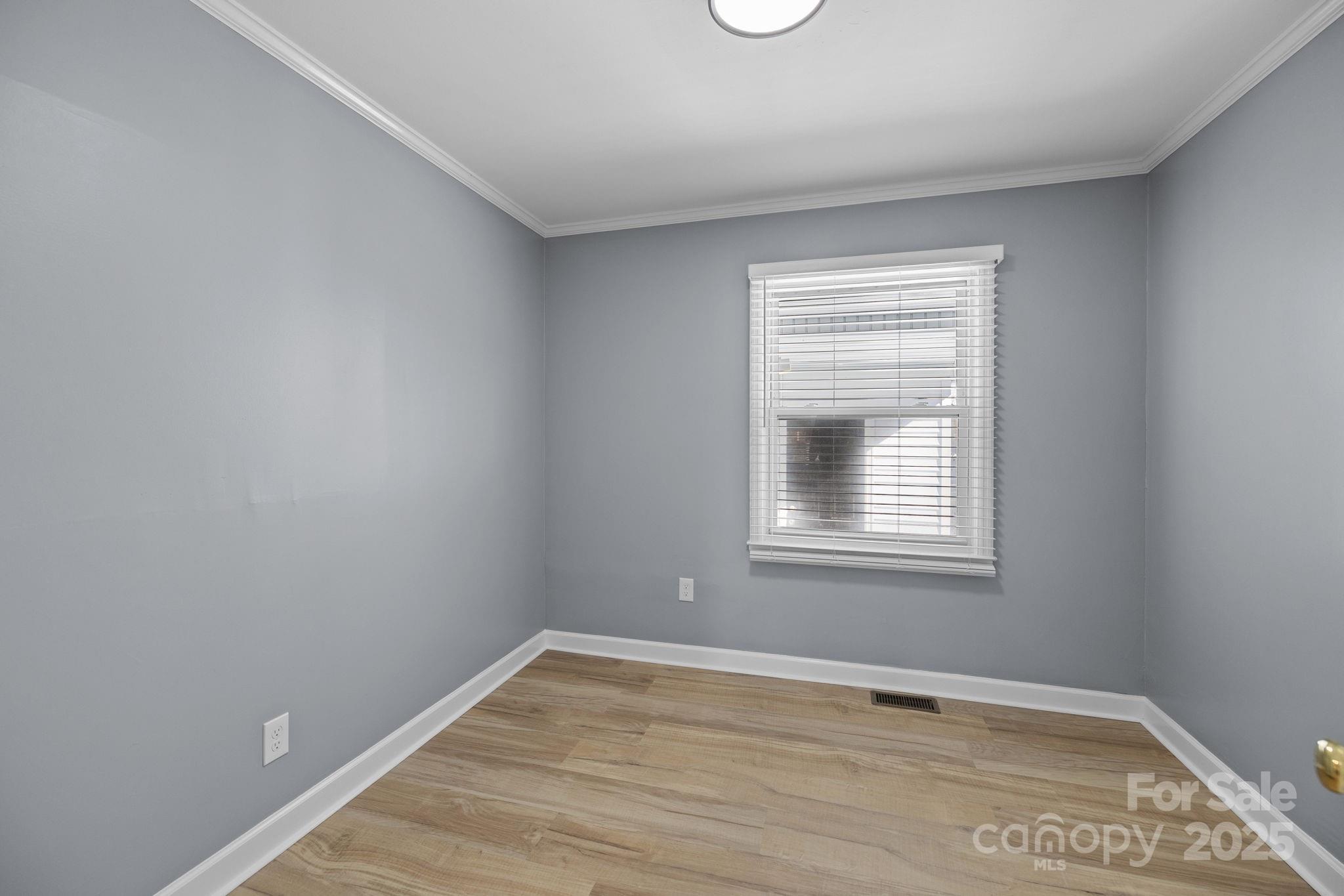 1804 Bennett Road Lancaster, SC 29720 - Photo 13 of 41 a view of an empty room with wooden floor and a window