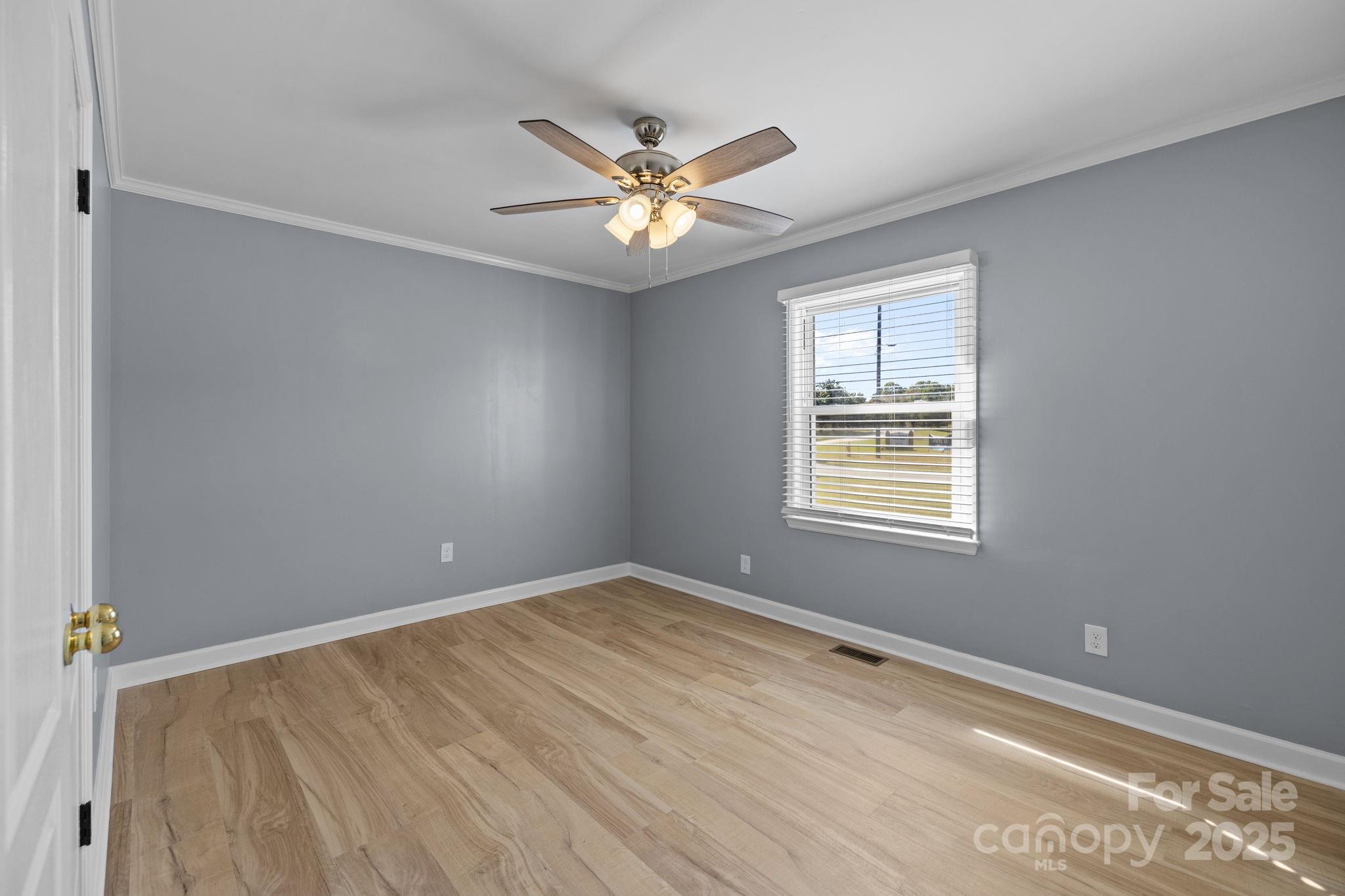 1804 Bennett Road Lancaster, SC 29720 - Photo 15 of 41 an empty room with windows and fan