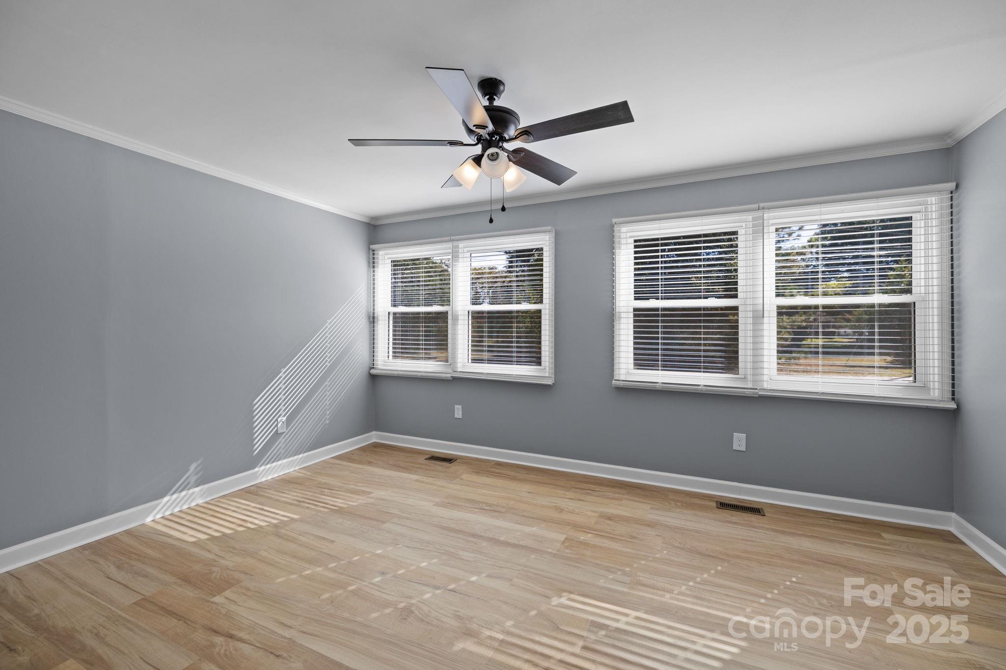 1804 Bennett Road Lancaster, SC 29720 - Photo 21 of 41 a view of an empty room with a window and wooden floor
