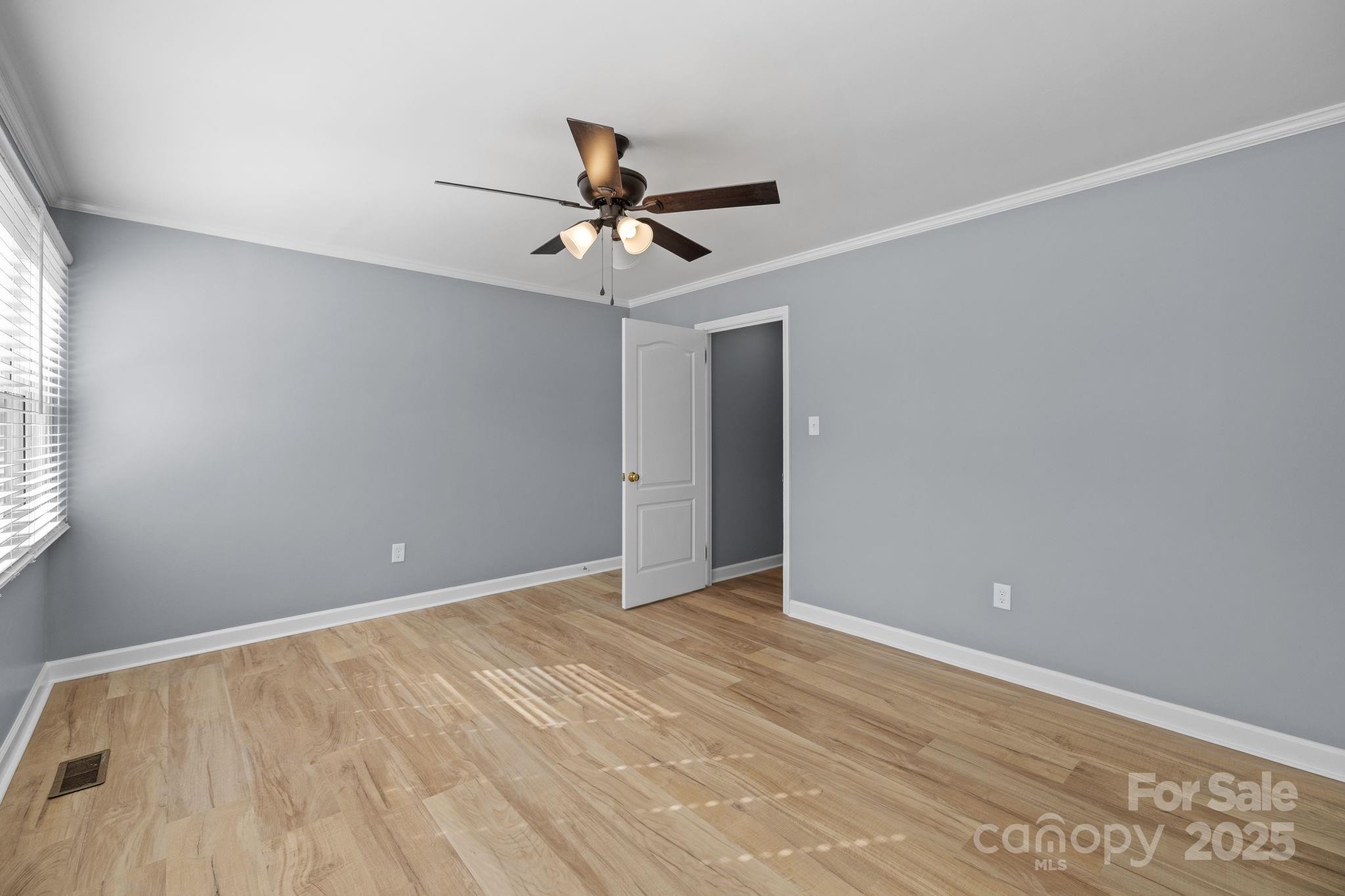 1804 Bennett Road Lancaster, SC 29720 - Photo 22 of 41 a view of an empty room with window and a ceiling fan