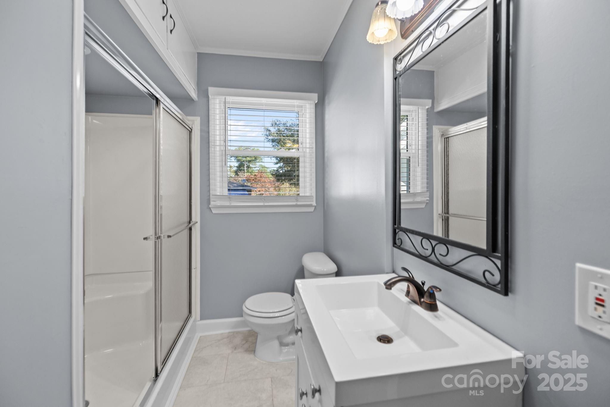 1804 Bennett Road Lancaster, SC 29720 - Photo 23 of 41 a bathroom with a sink toilet and mirror