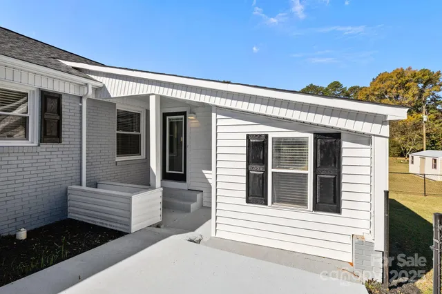 a view of a house with swimming pool